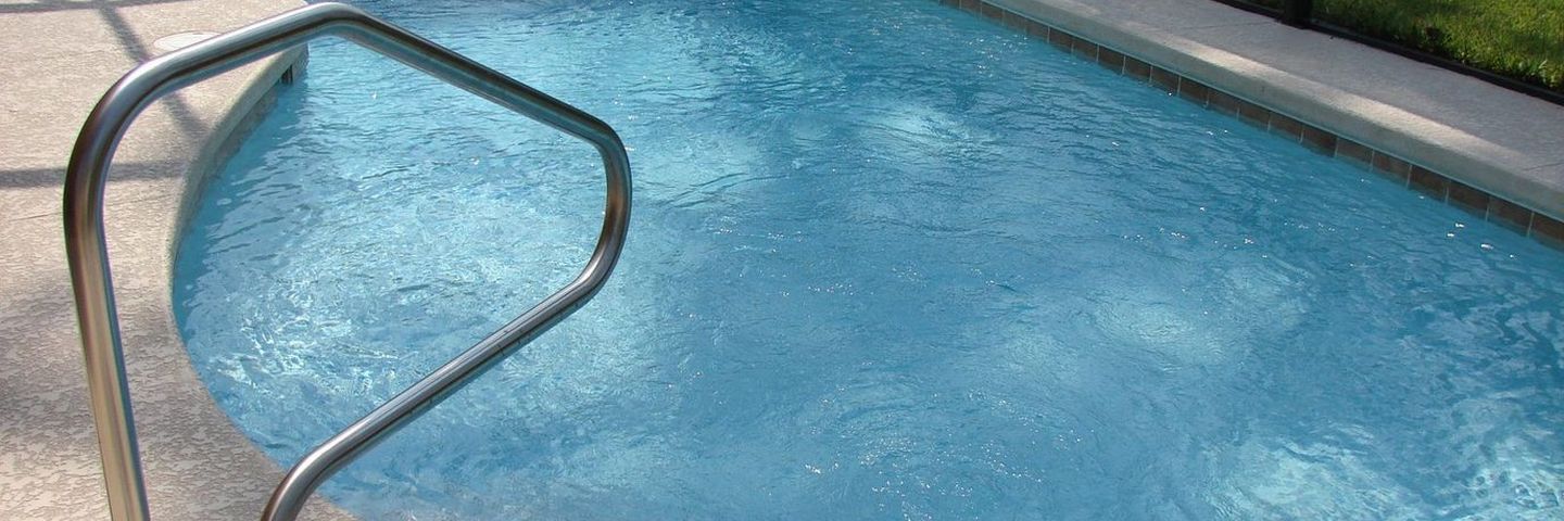 A clean residential swimming pool on a sunny day